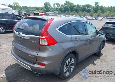 2015 Honda Cr-V Touring z USA, uszkodzony, nr VIN 5J6RM4H91FL058769